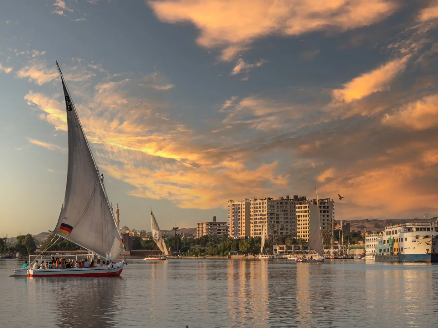 A dinner cruise boat moored on the Nile at dusk